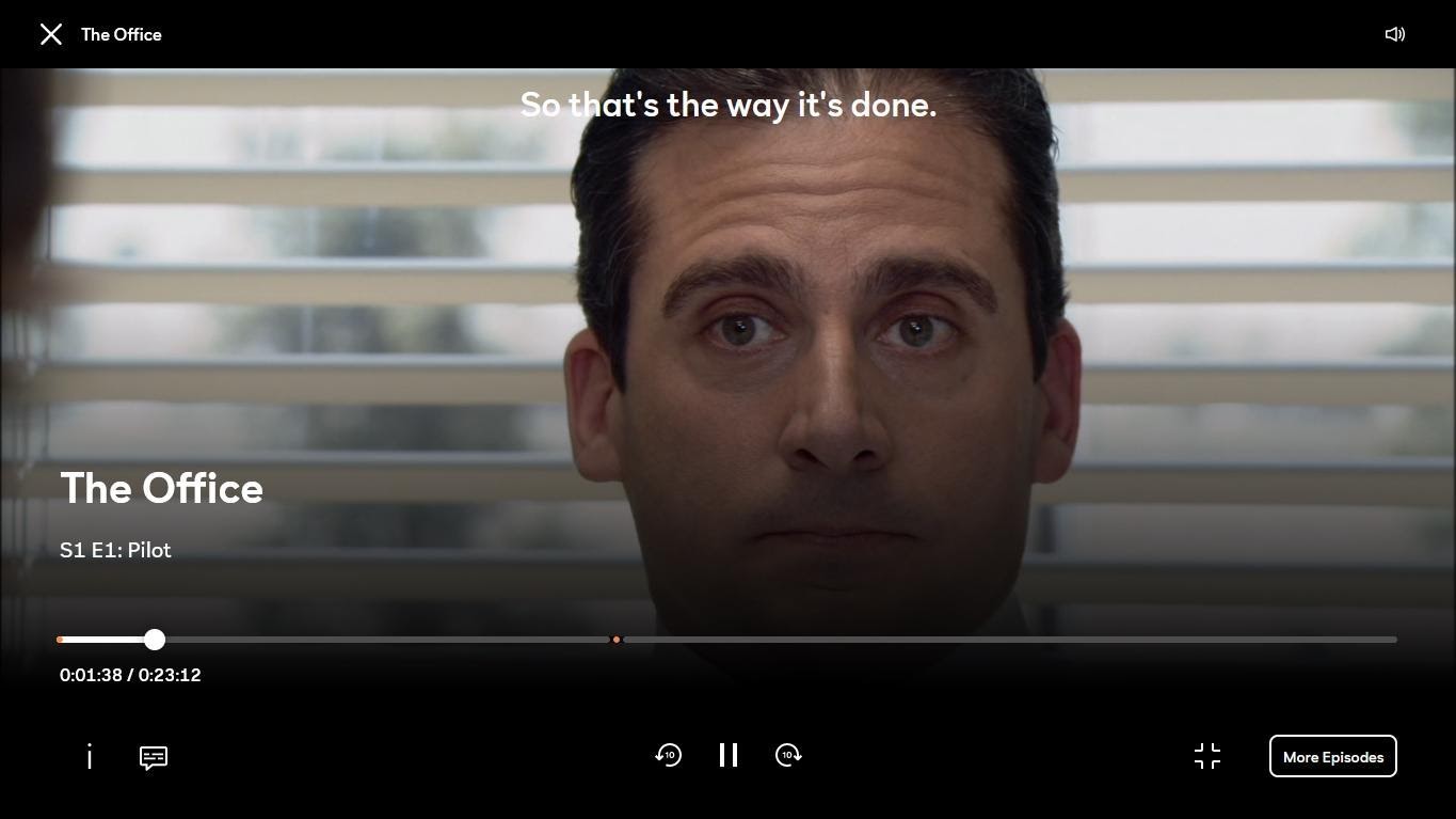 A screenshot of The Office Season 1 Episode 1 playing on Peacock TV with subtitles